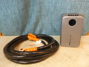 lot 12 image: RV Power Cord and Dehumidifier