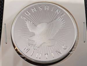 lot 57 image: Sunshine Minting One Troy Ounce .999 Fine Silver Round