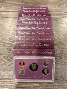 lot 197 image: United States Mint Proof Set Collection (1984-1993) Purple Card Packaging (Lot Of 10)