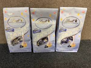 lot 252 image: 3 Bags Of Lindt Blueberries And Cream Chocolates