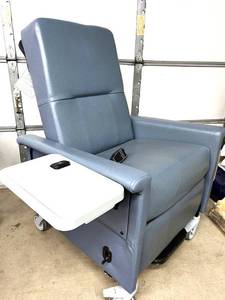 lot 18 image: MSRP $8000&nbspChampion mobile power patient recliner features electric recline, integrated seat heating, swing-out armrests for easier entryexit, a flip-up tray table &amp hospital-grade designed for long-duration clinical use - Works Great