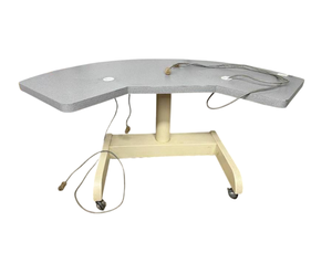 lot 1 image: MSRP $3500 Zeiss Humphrey Double Power Height Adjustable Instrument Table Double-sided work surface A wide, contoured tabletop that provides two usable instrument areas, allowing access from either side -Works Great - 1 Wheel not locking.
