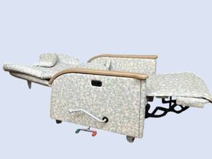 lot 5 image: Hospital Patient Mobile Recliner Chair with Flip-Up Tray Table. Fully reclining medical chair converts to near-flat position Padded arms, headrest, manual footrest, side tray table, and casters. Ideal for hospital, infusion, oncology, or recovery use.