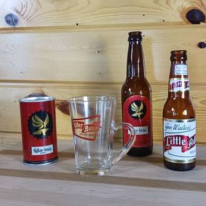 lot 22 image: Four-piece Adler collection, little Adler bottle, Can, glass with handle