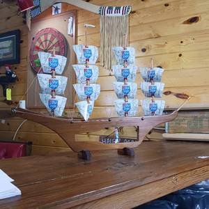 lot 24 image: Heilemans ship with sails made from actual beer cans. bottle display