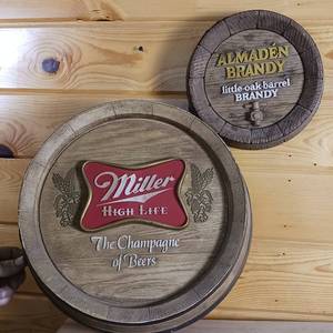 lot 56 image: Two Barrel End Advertising Signs � Little Oak Almaden Brandy (9inch) and Miller High life (14inches)