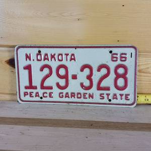 lot 64 image: North Dakota 1966 Peace Garden State embossed full size license plate