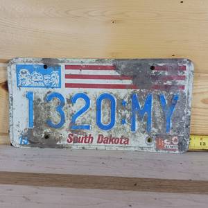 lot 67 image: South Dakota 1980  embossed License Plate full size needs cleaning