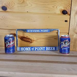 lot 76 image: Stevens Point Brewery home of Point Beer license Frame with two Special point  beer cans with piggy bank slots on top