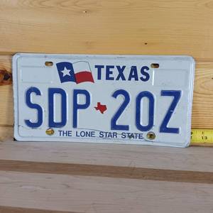 lot 100 image: Texas embossed license plate full size year unkown year