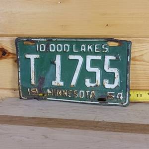 lot 105 image: Minnesota 1954 10inch license plate older embossing, fair condition for tractor plate of that era.