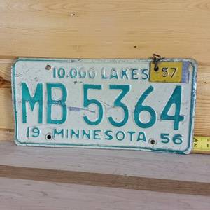 lot 106 image: 1956 Minnesota embossed (metal tag for 57) license plate full size