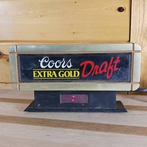 lot 112 image: Coors Extra Gold Draft Cash Register Sign, clock works � about 10 inches