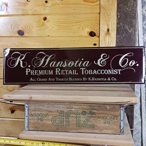 lot 158 image: Metal Sign K. Hansotia and Co. Premium Retail Tobacconist � All cigars and Tobacco blended