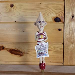 lot 183 image: Nude Beach Summer Wheat Point Beer Tap � Nearly 13 inches (used) � Stevens Point Brewery � Point Man holding a beer