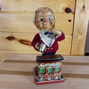 lot 208 image: Vintage Bartender with Shaker � Metal Toy that uses batteries � Rosko 1960 � missing martini glass
