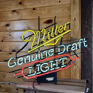 lot 242 image: hummm hummmm... This Neon Light works  Miller Genuine Draft Light about 30 inches wide by 24 inches