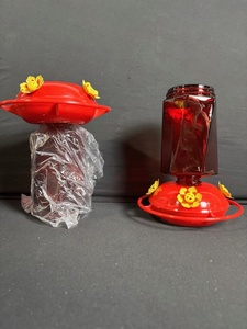 lot 19 image: 2x Red Glass Lantern Jars with Yellow Daisy Accents