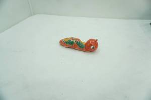 lot 706 image: Hand-Painted Mexican Talavera Ceramic BookwormCaterpillar Figurine