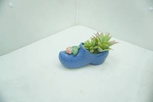 lot 710 image: Vintage Blue McCoy Ceramic Dutch Klompen Shoe Planter