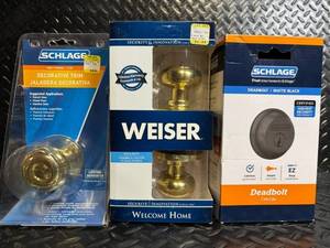 lot 119 image: Lock hardware lot Schlage Matte Black Deadbolt, Schlage Decorative Trim, Weiser Welcome Home Lockset