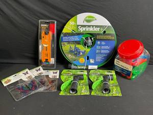 lot 209 image: Element Sprinkler 50ft Hose Reel, 2 Johnson Magnetic Torpedo Laser Levels, 4 GreenThumb Nozzles