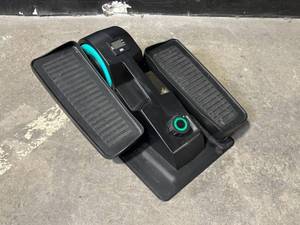 lot 19 image: Cubii Under-Desk Elliptical Pedal Trainer - Black with Teal Accent