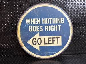 lot 45 image: Vintage Round Metal Sign - When Nothing Goes Right Go Left - 22 in. Diameter