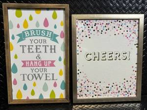 lot 58 image: Hobby Lobby Framed Wall Art Set - 2 Prints Brush Your Teeth & Hang Up Your Towel Cheers