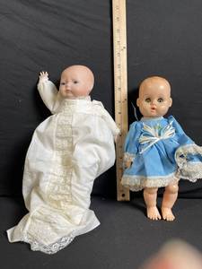 lot 201 image: Two Vintage Baby Dolls in White Lace Gown and Blue Dress