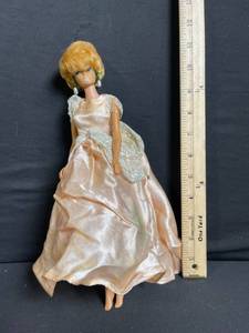 lot 218 image: Barbie Doll - Peach Satin Evening Gown with Lace Shoulder Overlay & Pearl Earrings