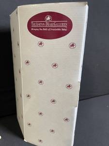 lot 222 image: The Ashton-Drake Galleries Doll - Sleepy Little Girl in Red Dress & Apron