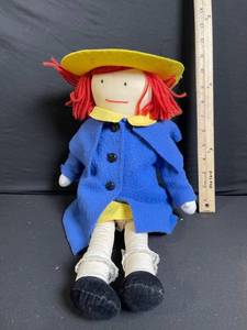 lot 256 image: Rag Doll Plush - Blue Coat, Yellow Hat, Red Yarn Hair