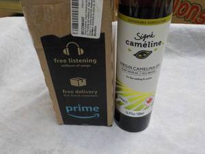 lot 217 image: 16.9 oz bottle Signe Cameline Virgi...