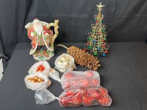 lot 55 image: Holiday Decor Lot with Fitz and Floyd Santa Pitcher, Metal Tree, Pinecone, and Assorted Ornaments