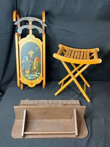 lot 56 image: Vintage Wooden Sled, Folding Stool, and Carved Wall Shelf Trio