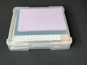 lot 194 image: Assorted Scrapbook Paper Collection in Plastic Storage Case