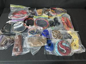 lot 216 image: Bulk Lot of Assorted Necklace Cords, Choker Wires, and Jewelry Making Strings