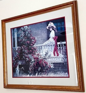 lot 182 image: Framed Artwork of Woman on Porch with Red Bow, 33x29 in