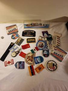 lot 382 image: Collection of Vintage Travel Patches, Keychains, Vietnam Memorabilia, and Souvenir Ship Model
