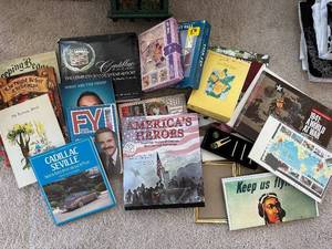lot 140 image: Americas Heroes & Cadillac Seville Vintage History Books & Auto Brochures