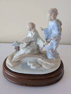 lot 44 image: Lladro Porcelain Figurine of Two Women in Kimonos on Wood Base