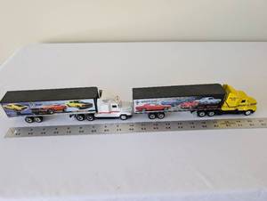 lot 58 image: Pair of Mustang Rally Die-Cast Tractor Trailers with Classic Mustang Graphics