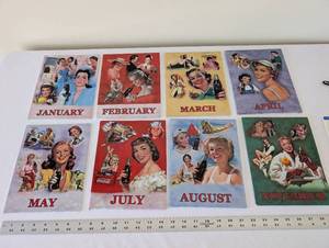 lot 64 image: 8 Piece Coca-Cola 1950s Calendar Girl Reproduction Tin Sign Set