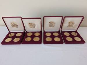 lot 79 image: Set of 16 Grand Casino Mille Lacs Hinckley $5 Collectible Gaming Tokens in Display Cases