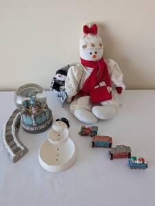 lot 99 image: Holiday Decor Collection with Snowman Dolls, Musical Snow Globe, Christmas Train, and Cinderella Collector Plate