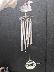 lot 122 image: Loon windchime, made out of a heavy metal
