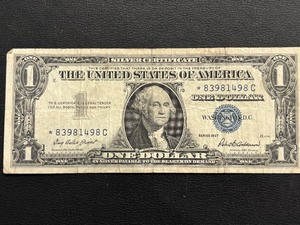 lot 79 image: 1957 Blue Seal $1 Dollar Silver Certificate Star Note