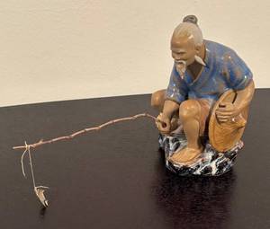 lot 249R image: LR - Asian Mud Man Fisherman Figurine with Fishing Pole