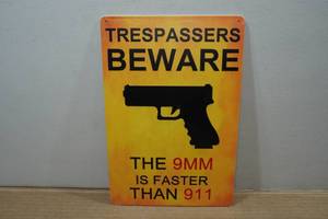 lot 94 image: Novelty Metal Sign - Trespassers